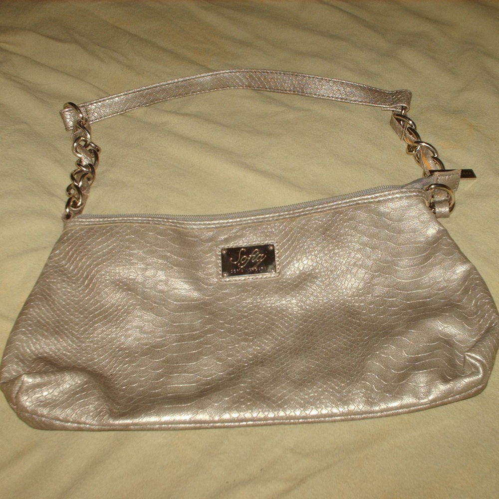 Sofia Vergara snakeskin print purse handbag